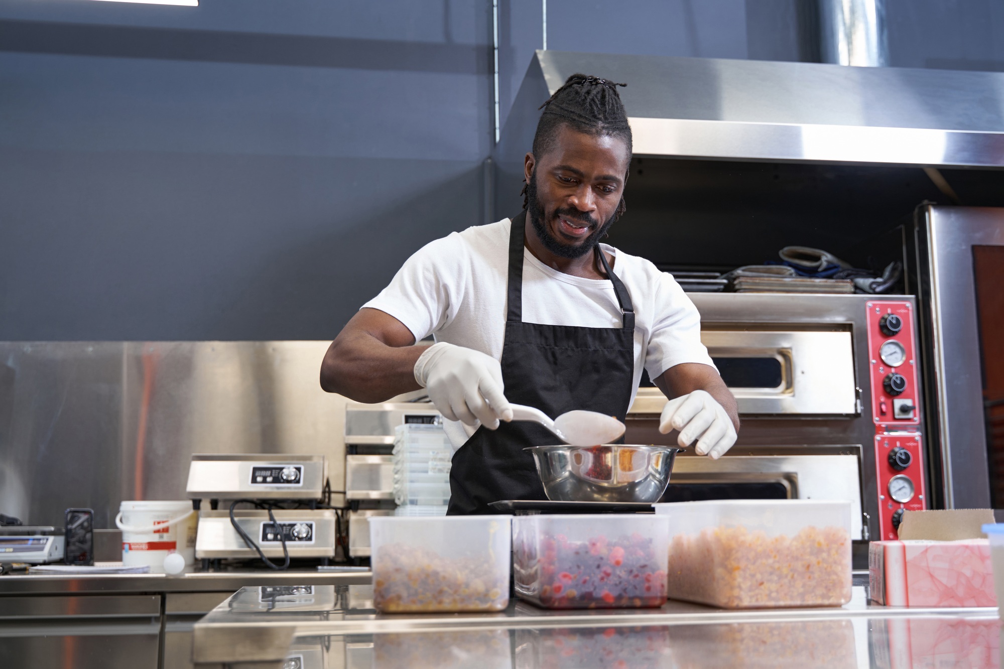 American chef preparing ingredients for baking at the kitchen