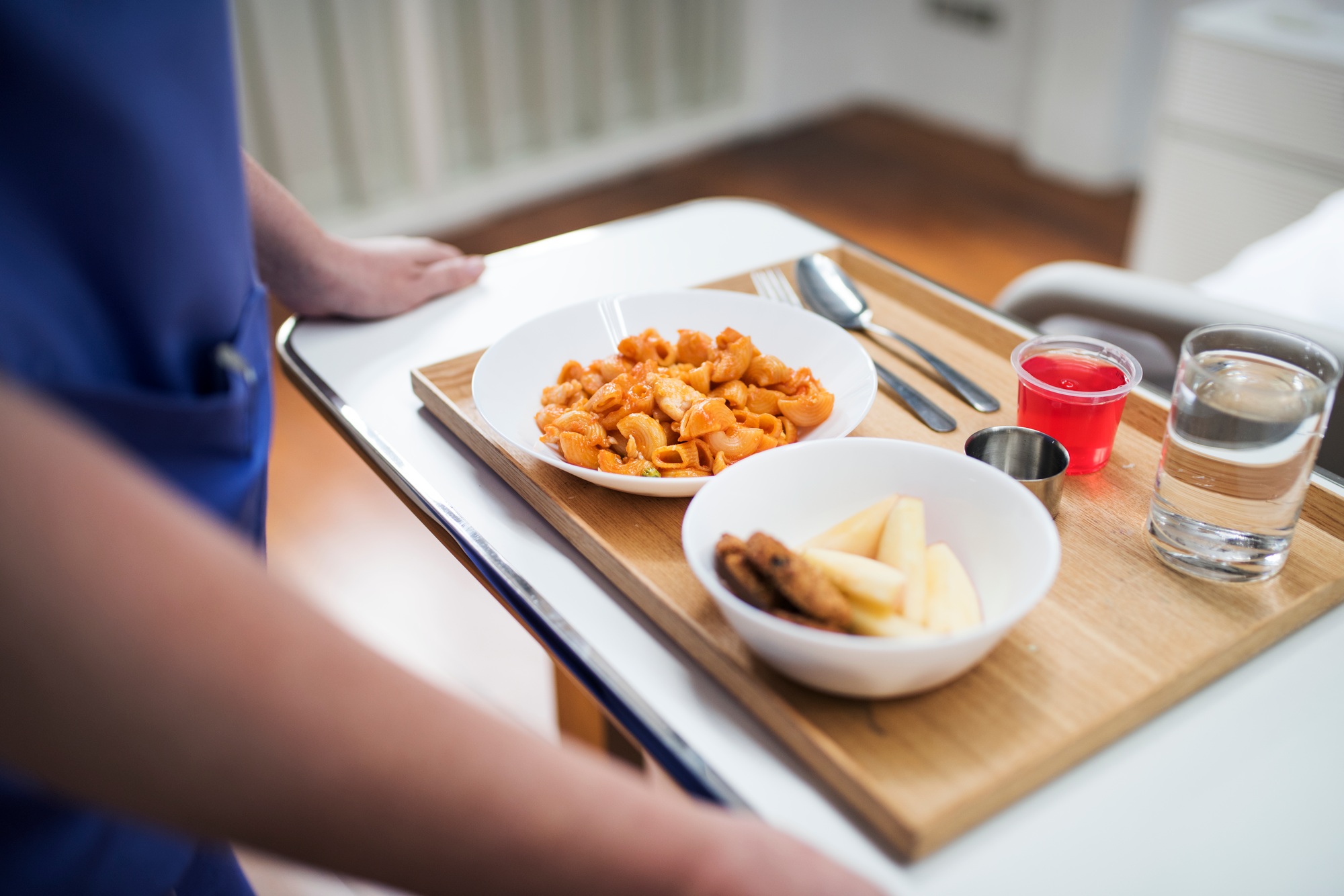 Nurse bringing in a hospital food